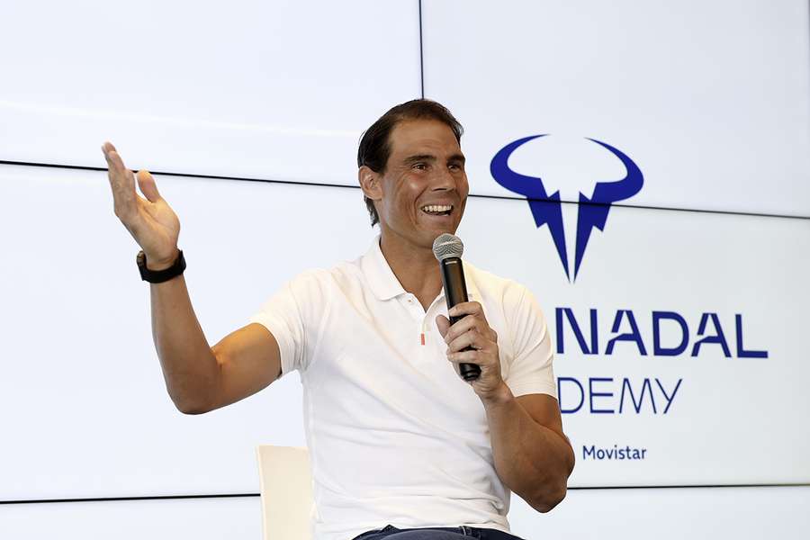 Nadal gestures as he talks during a press conference in Manacor
