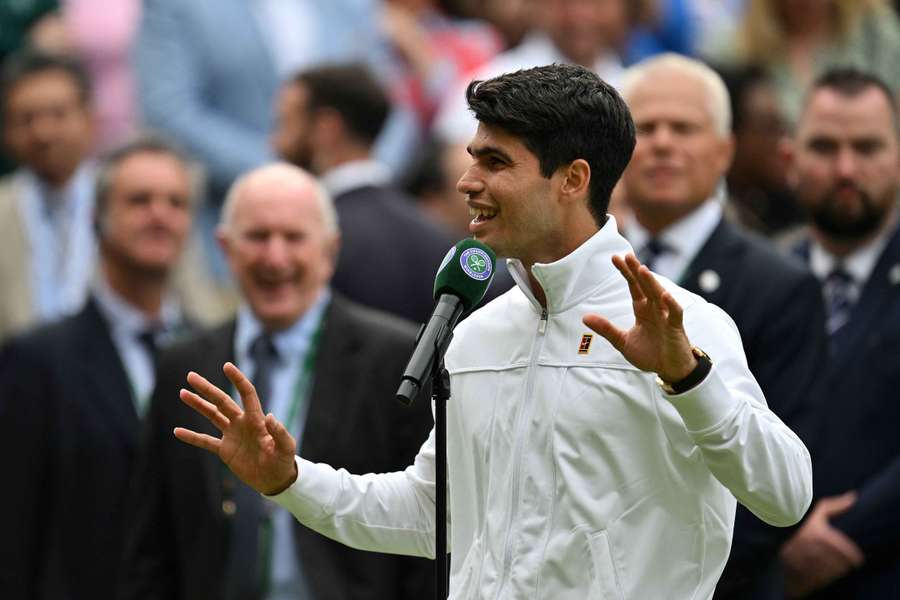 Alcaraz speaks to the crowd after his semi-final win