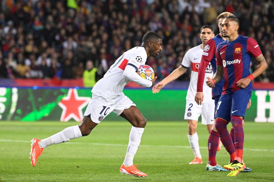 Paris Saint-Germain's French forward #10 Ousmane Dembele celebrates after scoring his team's first goal