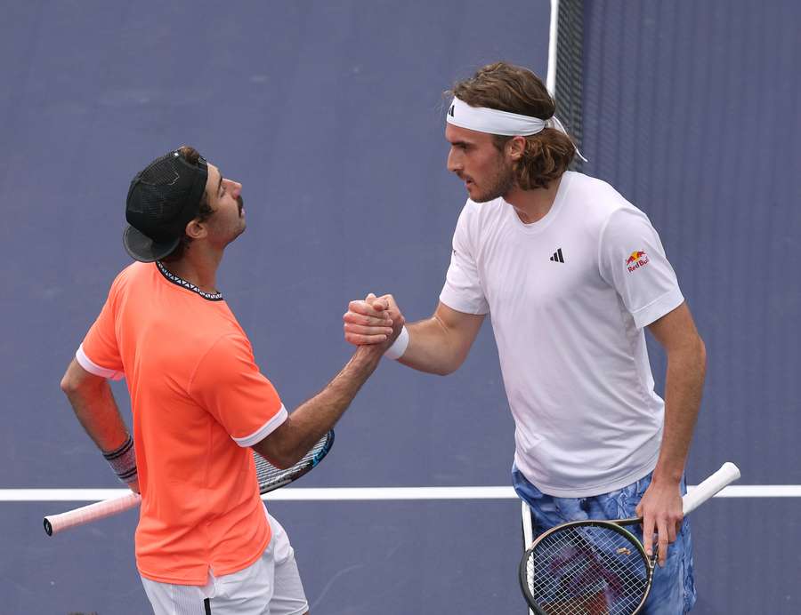 Jordan Thompson of Australia (L) shakes hands with Stefanos Tsitsipas of Greece