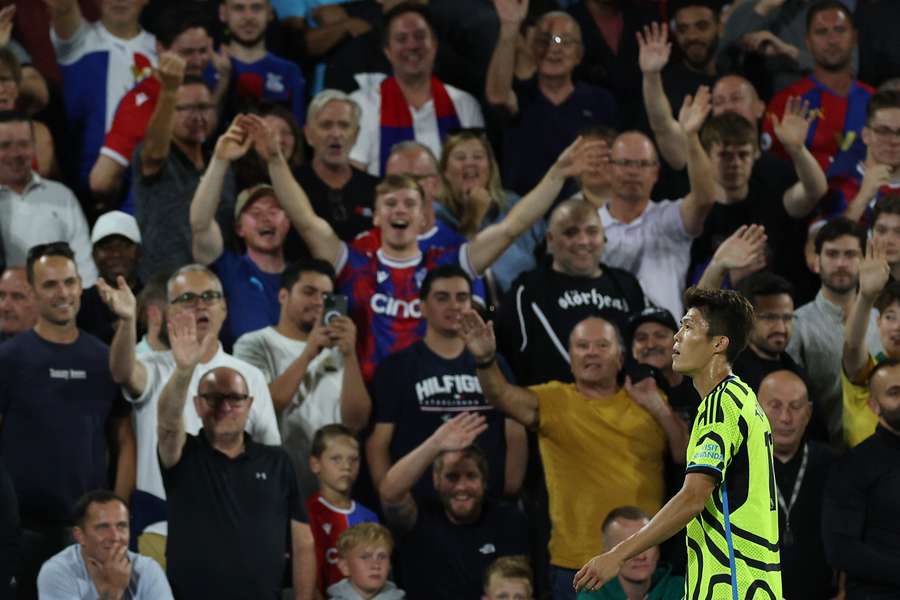 Palace supporters gesture as Arsenal's Japanese defender #18 Takehiro Tomiyasu leaves the pitch after being sent off