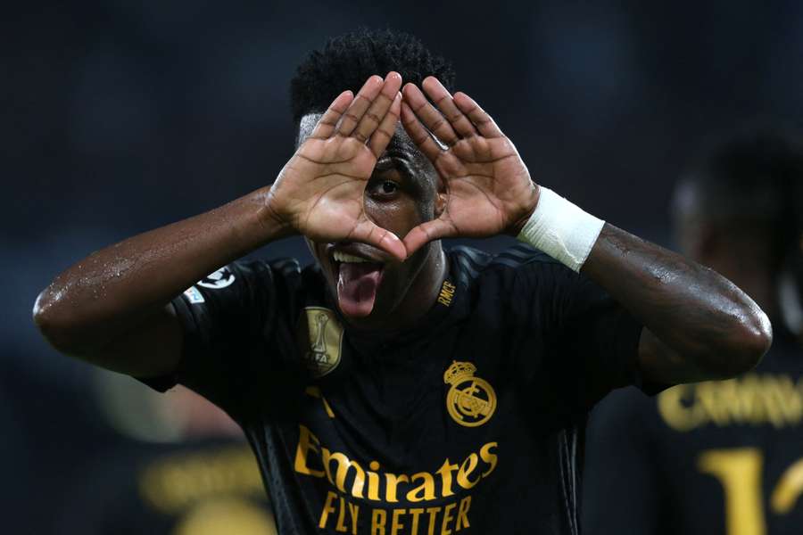 Real Madrid's Brazilian forward #07 Vinicius Junior celebrates after scoring against Napoli