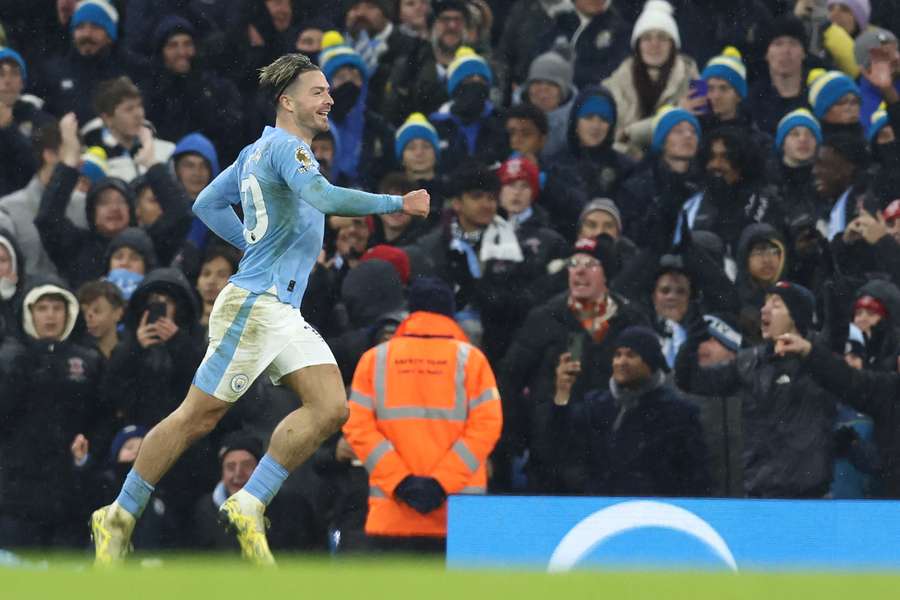 Manchester City's English midfielder #10 Jack Grealish celebrates after scoring their third goal