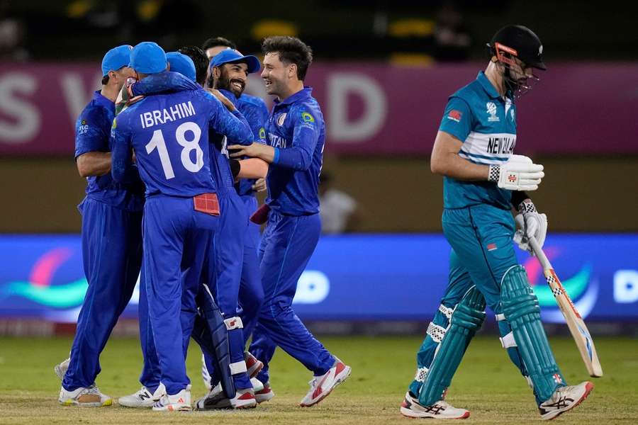 Afghanistan celebrate the dismissal of New Zealand's Daryl Mitchell