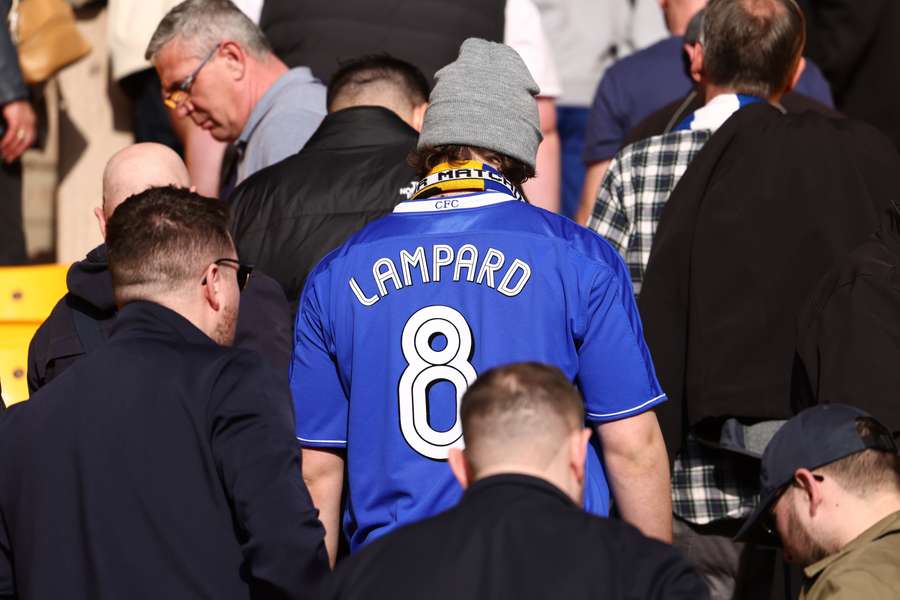 Chelsea fans leave at the end of the English Premier League football match between Wolves and Chelsea