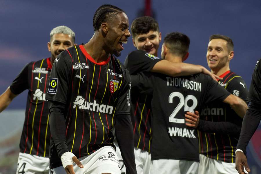 Lens' Elye Wahi celebrates after scoring against Clermont - before he was sent off for two first-half bookings