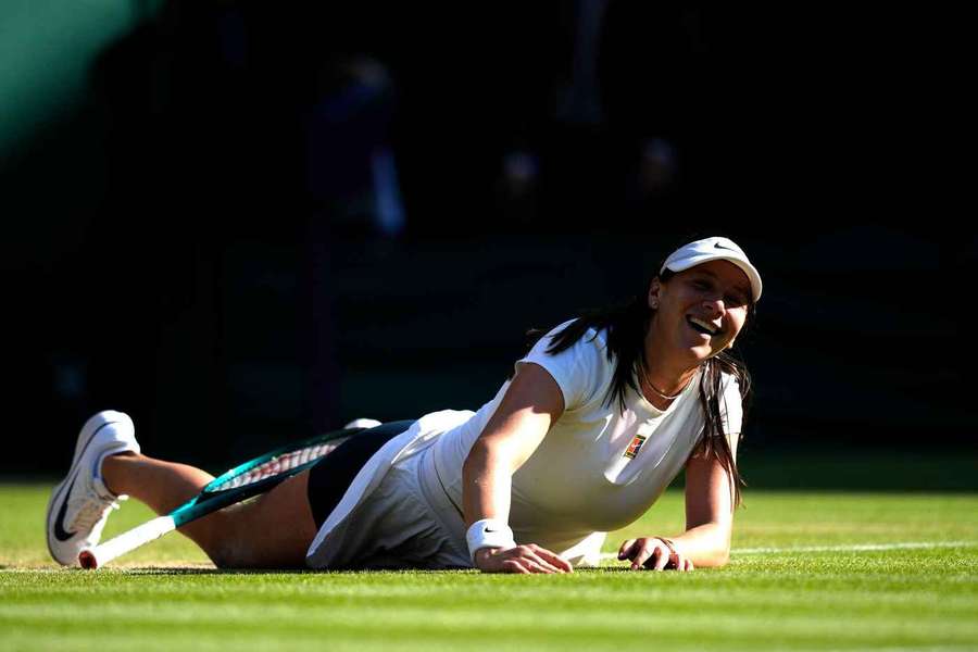 Anisimova drops to the floor after her win over Pavlyuchenkova