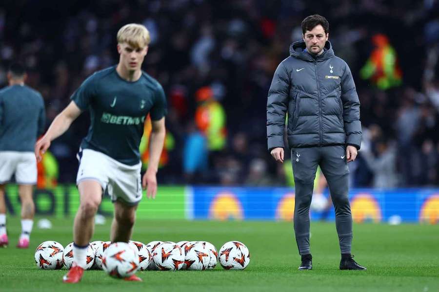 Former Tottenham Hotspur coach Ryan Mason (right) watches on before the game against Eintracht Frankfurt