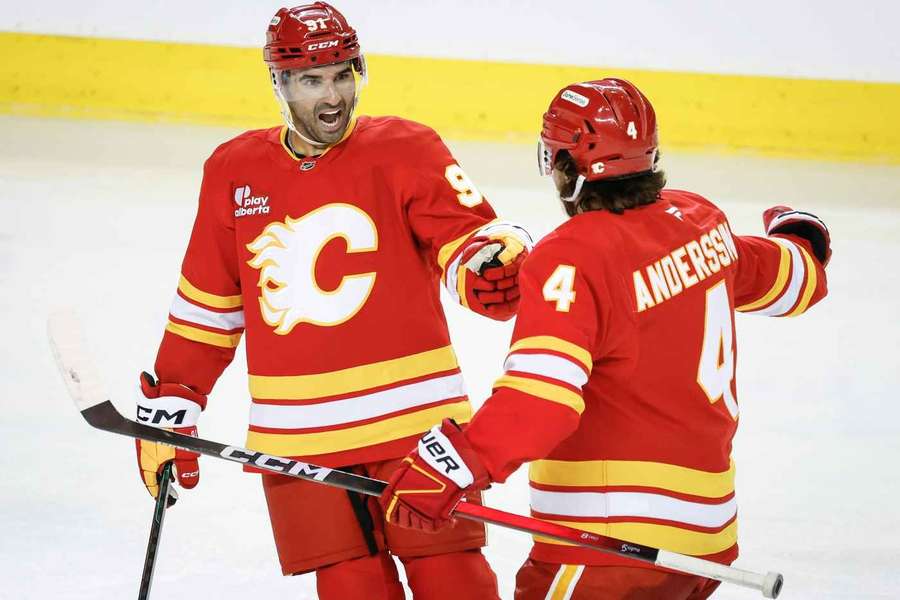 Calgary Flames' Nazem Kadri (left) and Rasmus Andersson celebrate