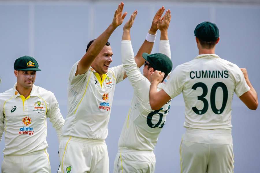 The Australia players celebrate their win