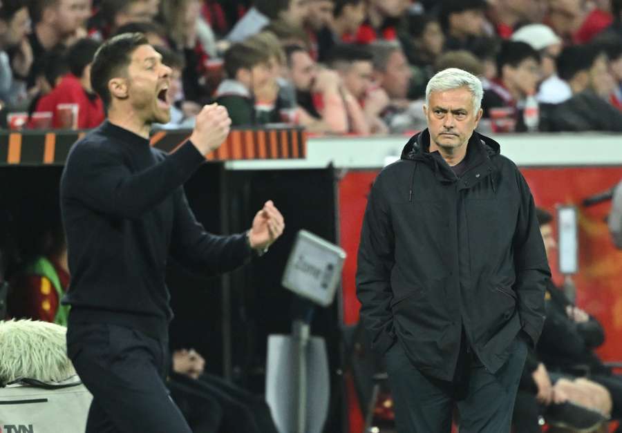 Bayer Leverkusen coach Xabi Alonso gestures next to Roma coach Jose Mourinho