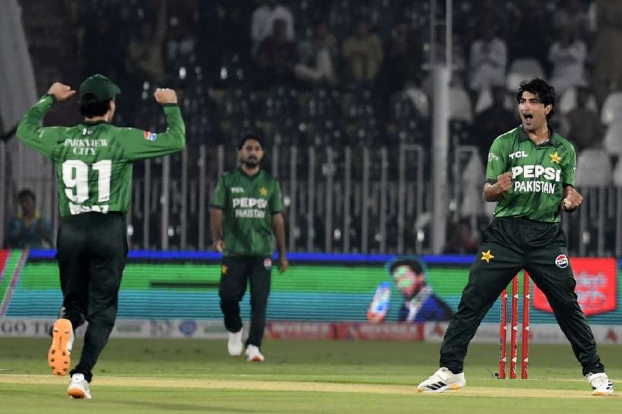 Pakistan players celebrate taking a wicket Pakistan players celebrate taking a wicket