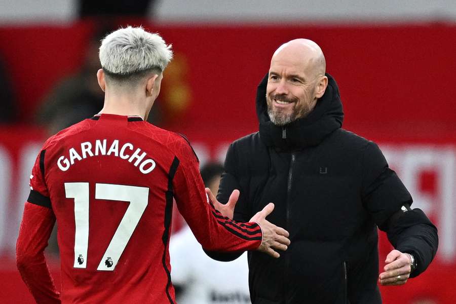 Manchester United manager Erik ten Hag (R) congratulates Alejandro Garnacho
