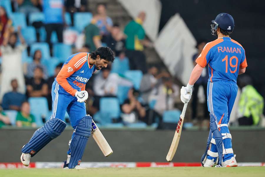 India's Tilak Varma (left) celebrates after scoring his century