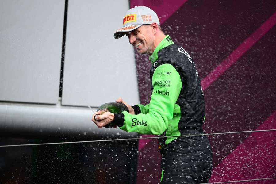 Nico Hulkenberg sprays champagne after securing his first F1 podium