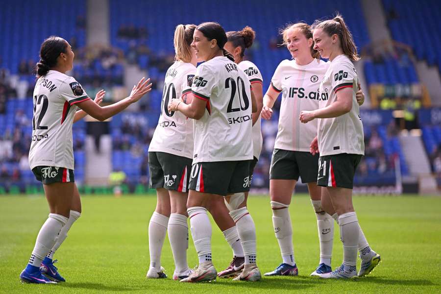 Sam Kerr celebrates with her teammates after breaking Chelsea's WSL record.