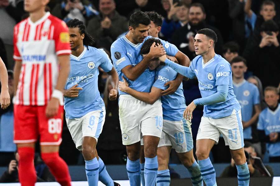 Julian Alvarez celebrates with teammates after scoring Man City's equalising goal against Red Star