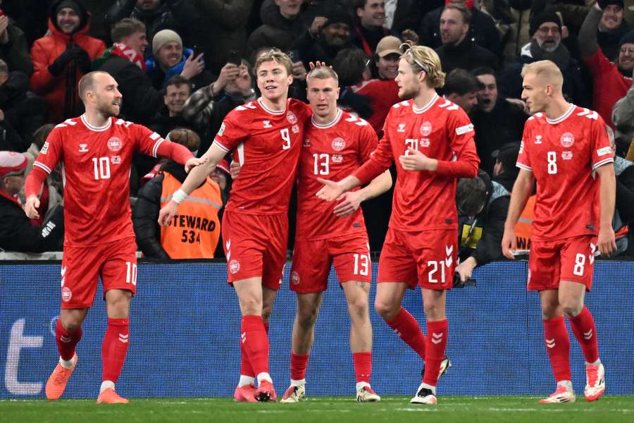 Denmark's players celebrate after Rasmus Hojlund scored his team's only goal against Portugal