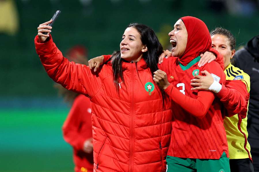 Morocco's players celebrate after qualifying for the knockout rounds