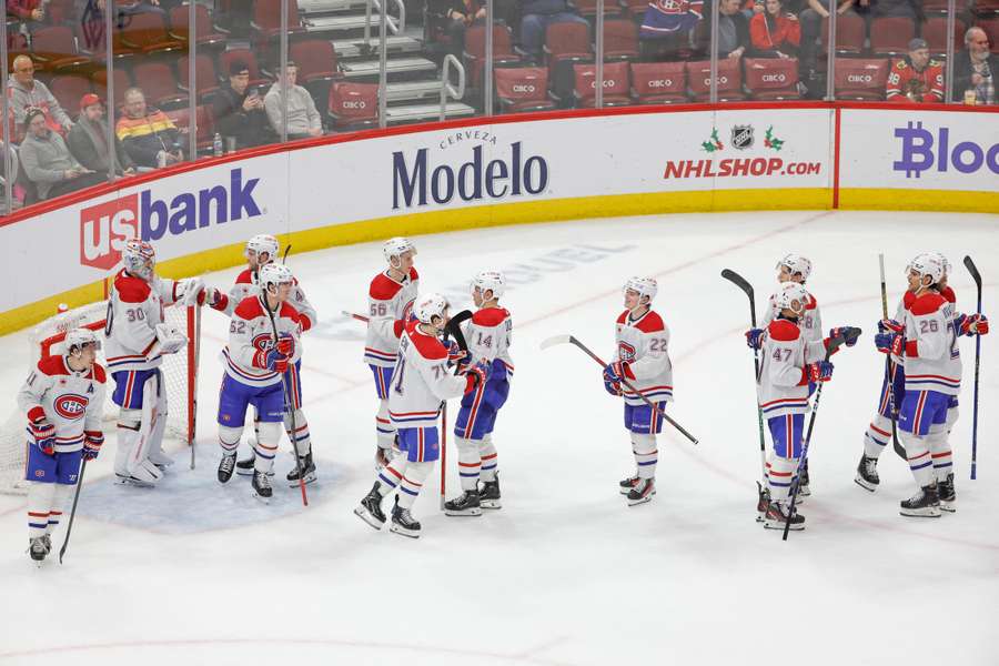 Montreal Canadiens players celebrate after defeating the Chicago Blackhawks at United Center