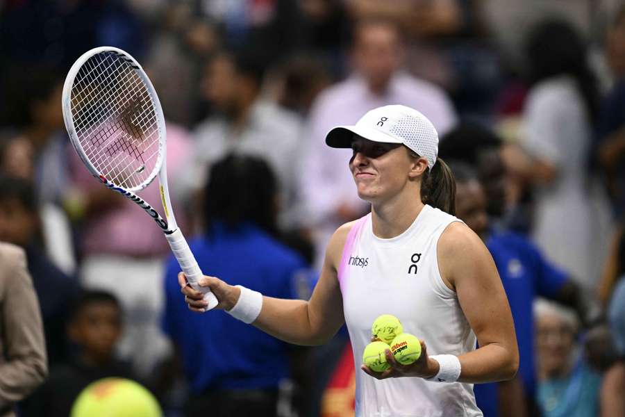 Iga Swiatek smiles after defeating Liudmila Samsonova during their US Open last 16 match