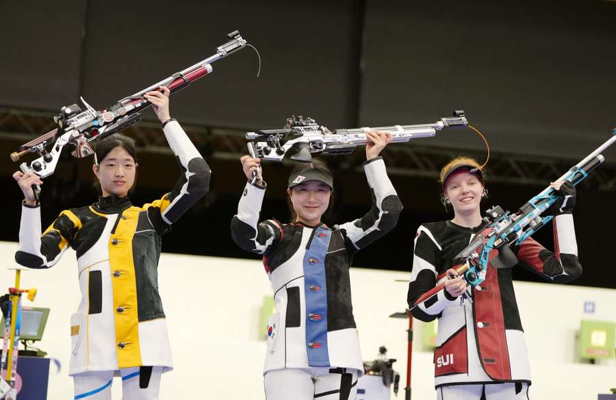 Silver medallist Yuting Huang of China, gold medallist Hyojin Ban of South Korea and bronze medallist Audrey Gogniat of Switzerland pose with their air rifles