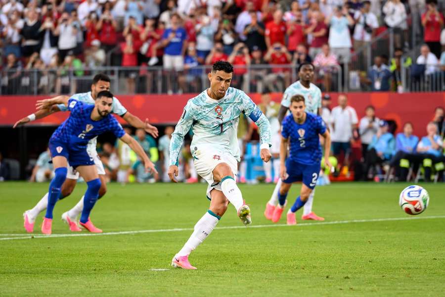 Portugal's Cristiano Ronaldo scores from the penalty spot against Croatia.
