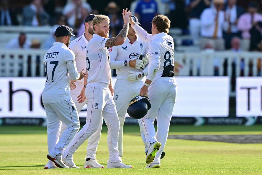 Ben Stokes celebrates with team-mates at the end of play on the fourth day at Lord's