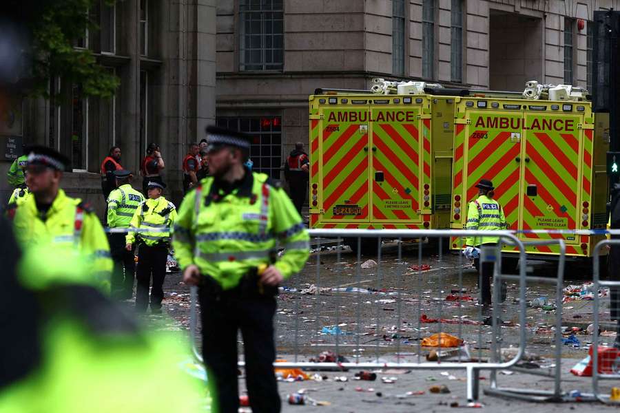 Emergency services at an incident involving a car and supporters during the victory parade in Liverpool