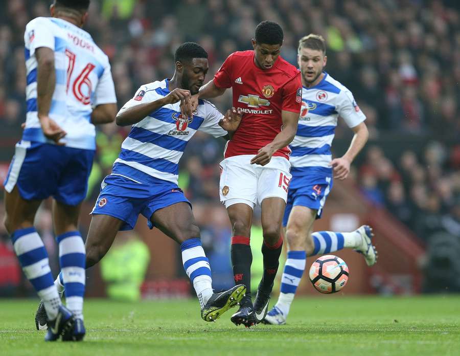 Tyler Blackett tussles with Manchester United's Marcus Rashford while in action for Reading Tyler Blackett tussles with Manchester United's Marcus Rashford while in action for Reading