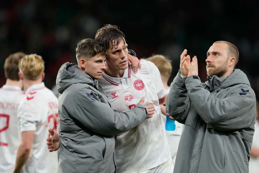 Denmark's Jesper Lindstrom, Jannik Vestergaard and Christian Eriksen comfort each other after brutal defeat in Lisbon