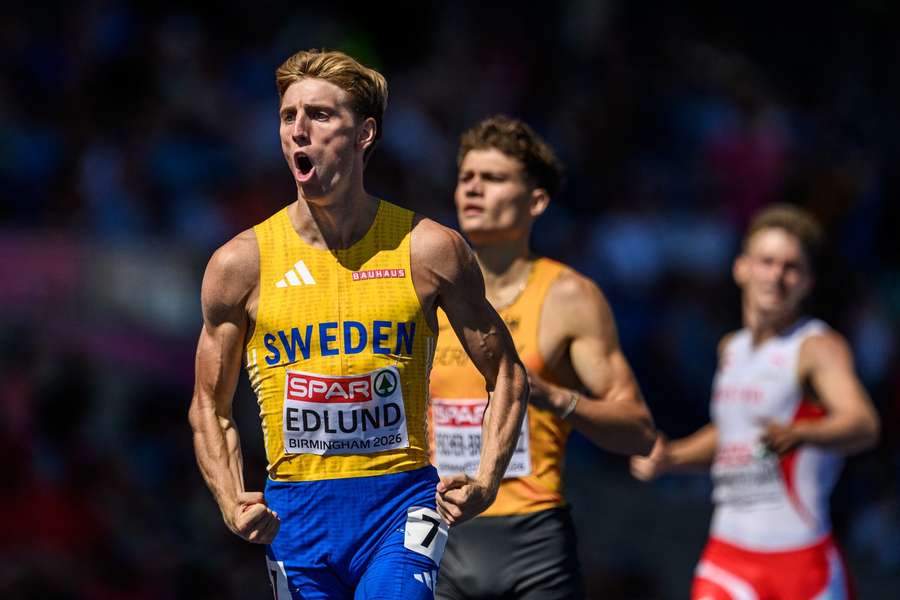 Oskar Edlund celebrates his win in the 400m hurdles semi-finals