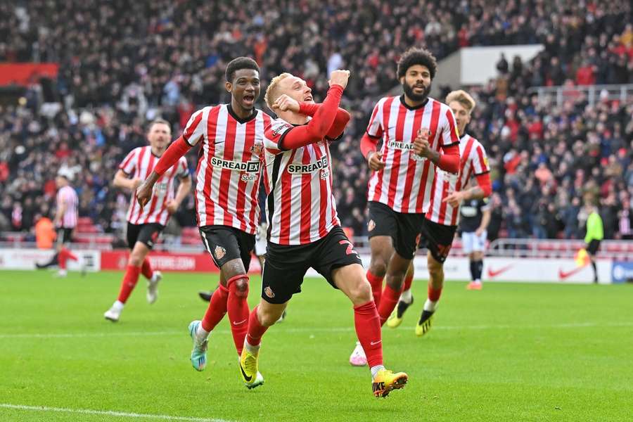 Alex Pritchard celebrates with a nod to Millwall's arch-rivals West Ham United