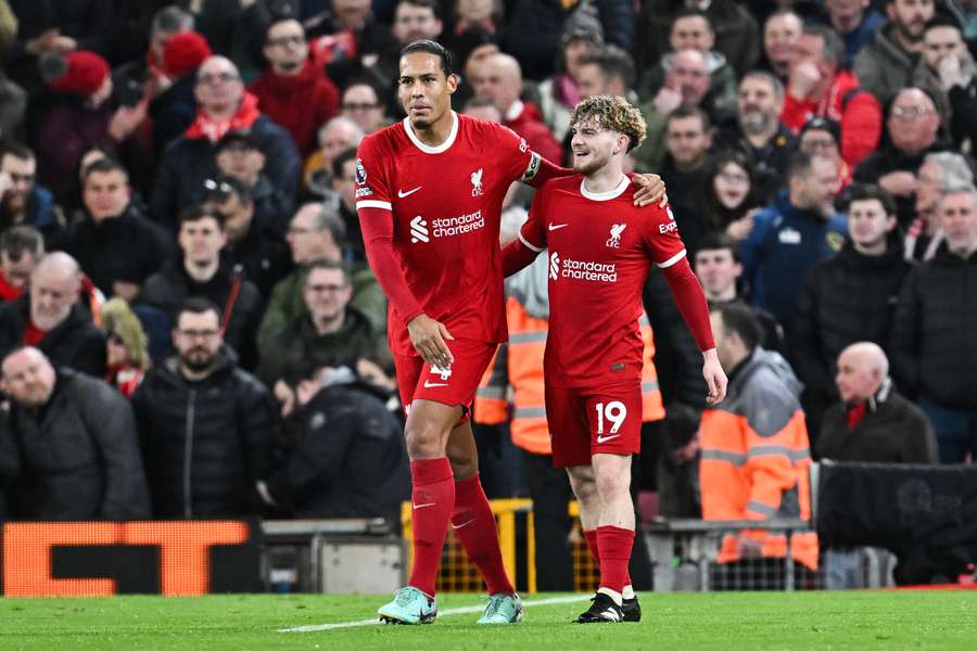 Liverpool's Virgil van Dijk (L) and Harvey Elliott