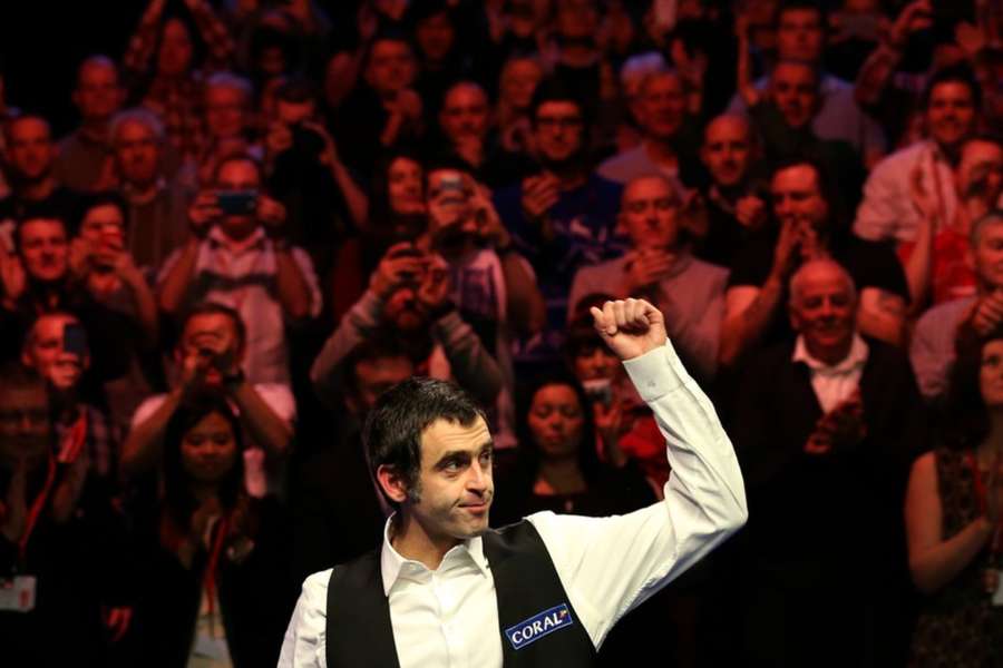 Ronnie O'Sullivan of England celebrates after winning the Snooker UK Championship in 2014