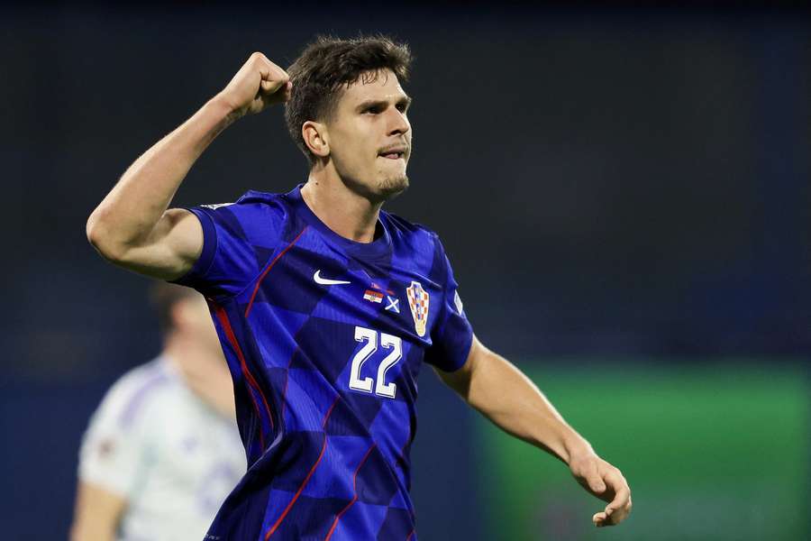 Croatia's forward Igor Matanovic celebrates scoring his team's first goal