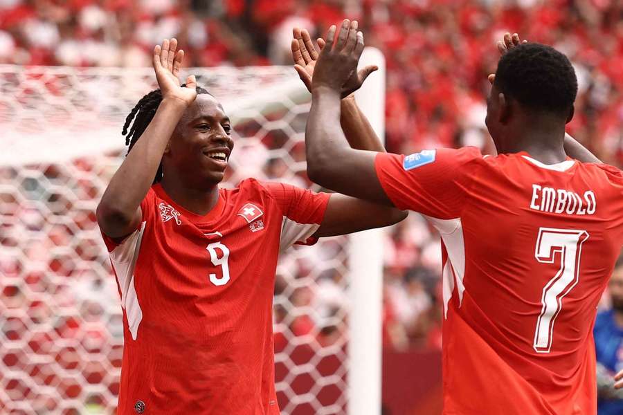 Johan Manzambi celebrates scoring Switzerland's second goal against Canada with Breel Embolo Johan Manzambi celebrates scoring Switzerland's second goal against Canada with Breel Embolo