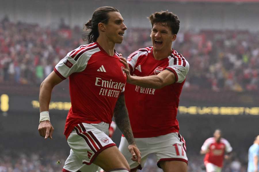 Tzolis (R) celebrates with Calafiori after Arsenal's first goal Tzolis (R) celebrates with Calafiori after Arsenal's first goal