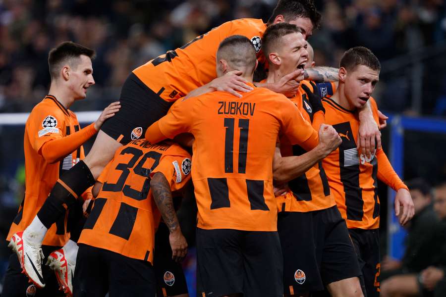 Danylo Sikan celebrates with teammates after giving Shakhtar the lead against Barcelona