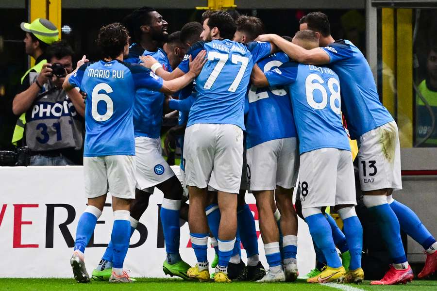 Napoli beat champions Milan to go top of Serie A