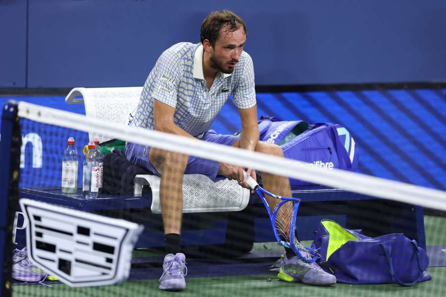 Daniil Medvedev sits on his chair after crashing out of the US Open first round following the latest in a long line of on-court meltdowns