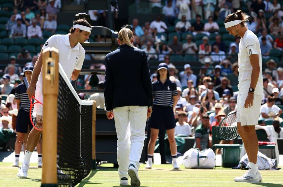 Zverev (right) and Fritz look on during the coin toss