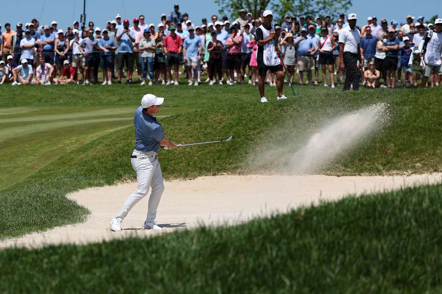 Rory McIlroy plays his shot out of a bunker