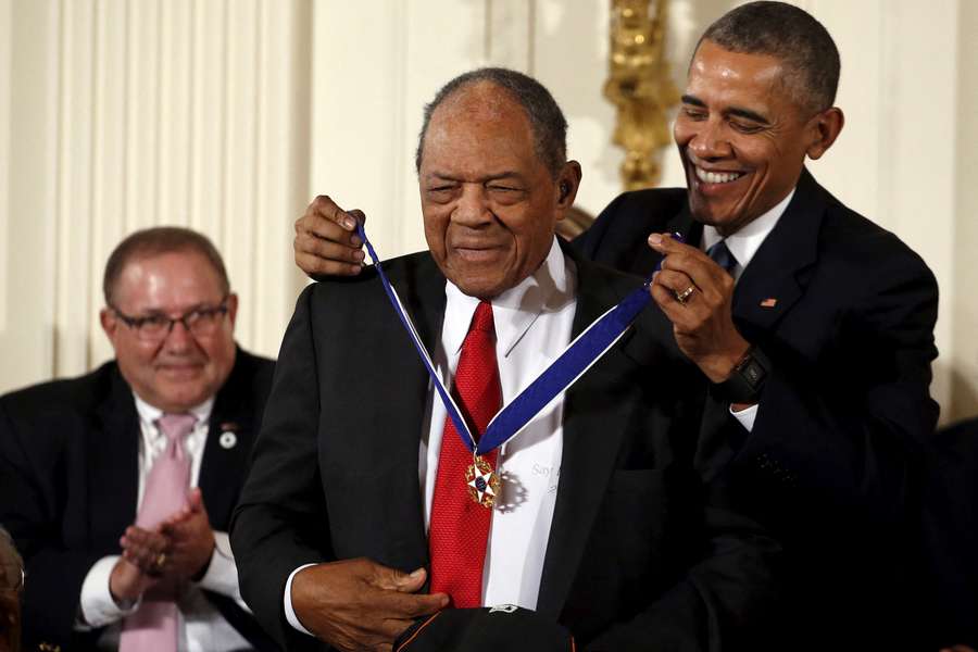 Former president Barack Obama presents the Presidential Medal of Freedom to former professional baseball player Willie Mays in 2015