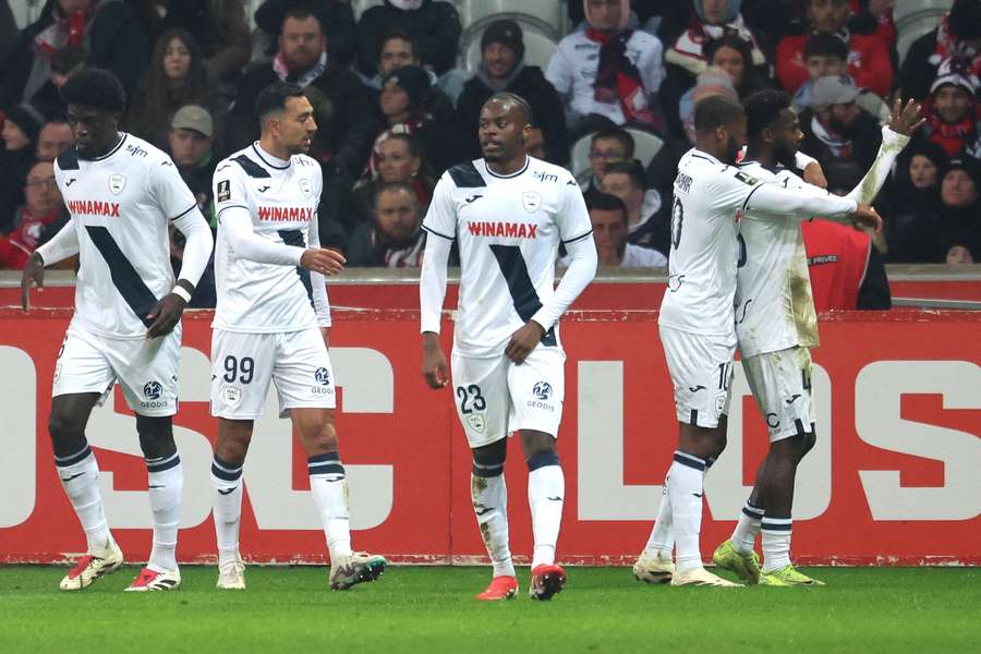 Issa Soumare, right, celebrates with teammates after scoring his team's second goal against Lille