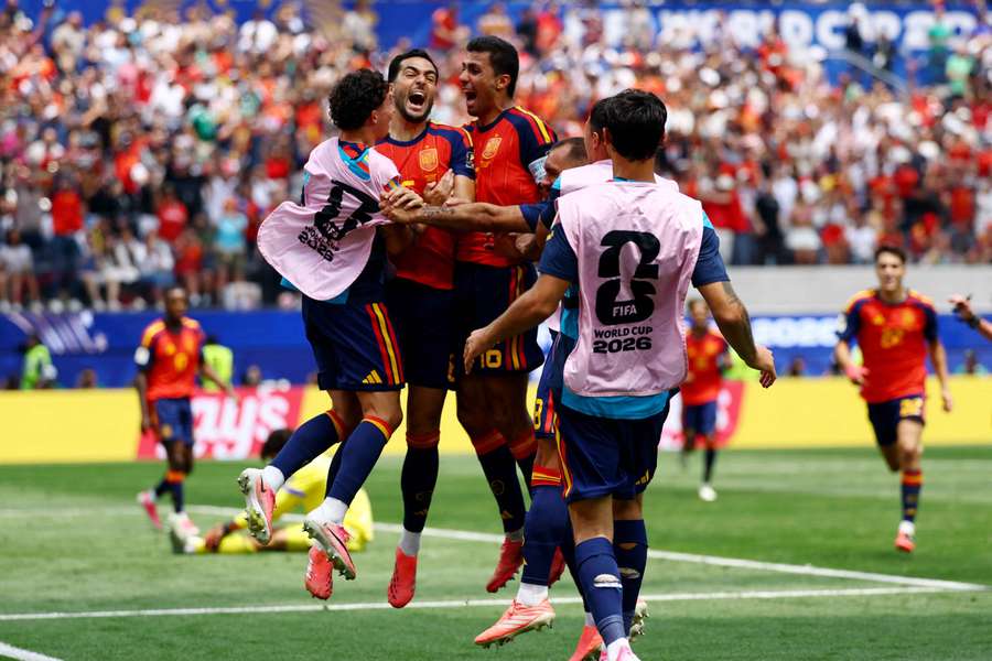 Spain celebrate Mikel Merino's late winner