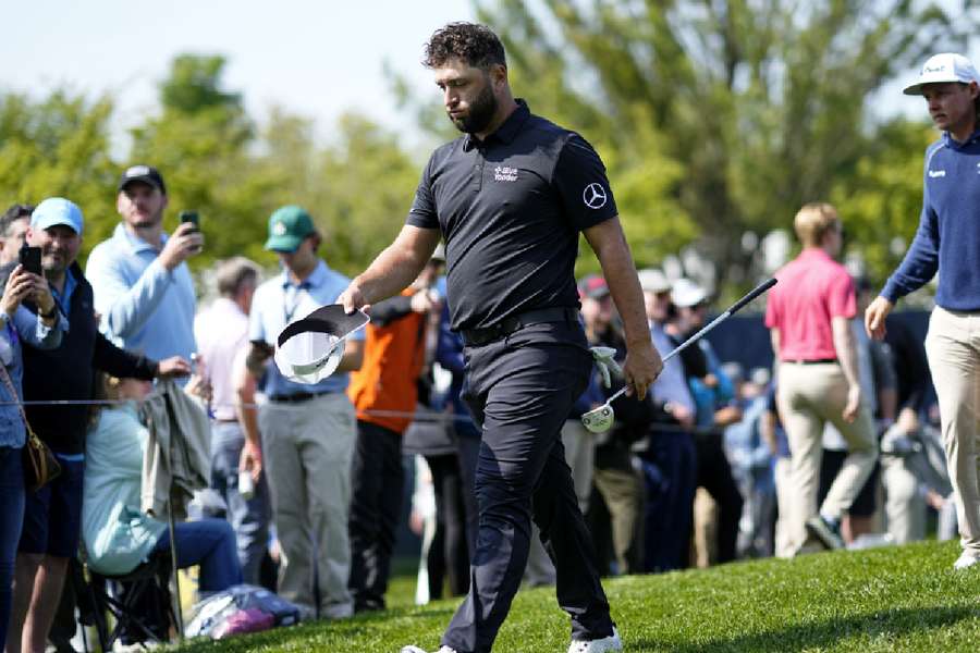 Jon Rahm reacts as he walks off the ninth green after completing the first round of the PGA Championship 