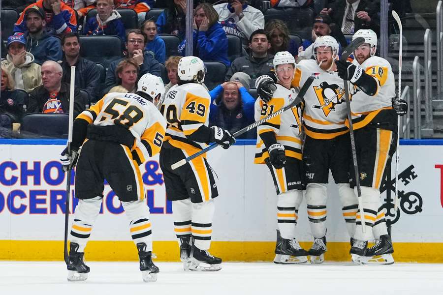 Penguins players celebrate win over Islanders