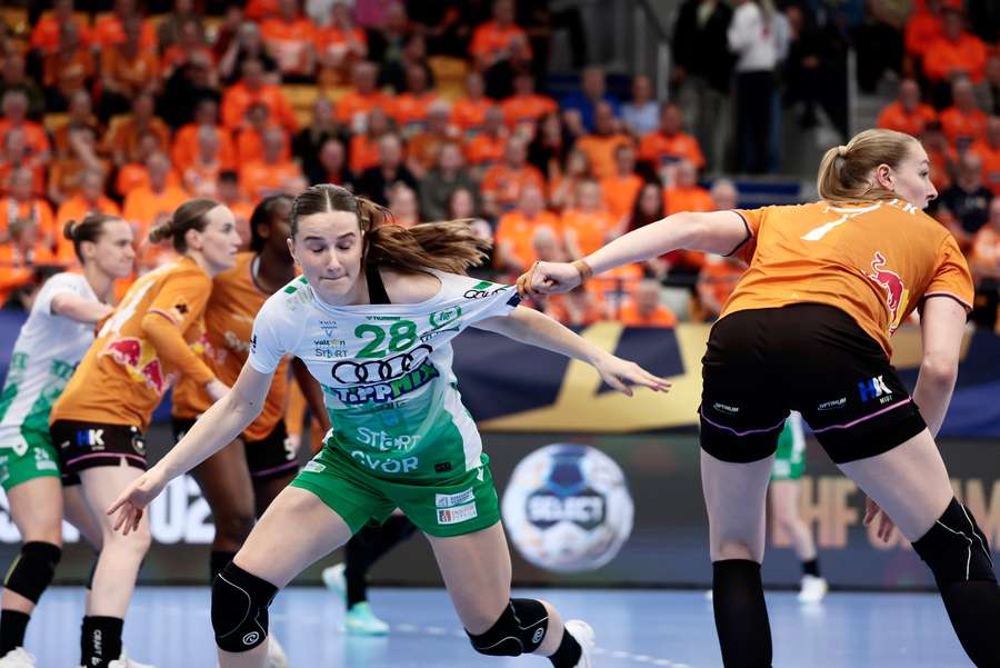 Gyor's Bo van Wetering (L) and Odense's Viola Leuchter in action during the Women's Champions League quarter-final 