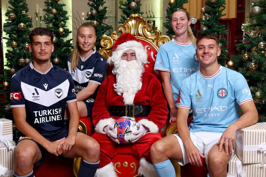 Melbourne Victory and Melbourne City players sit with the big fella ahead of their annual Christmas derby. 